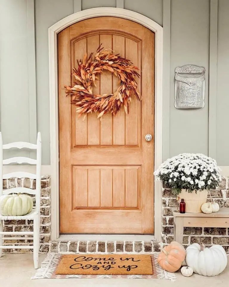 Arched Wood Door with Leaf Wreath
