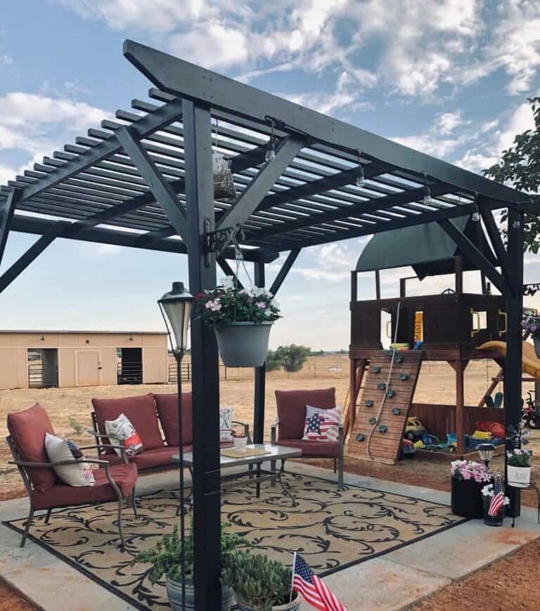 Black Pergola with Red Chairs