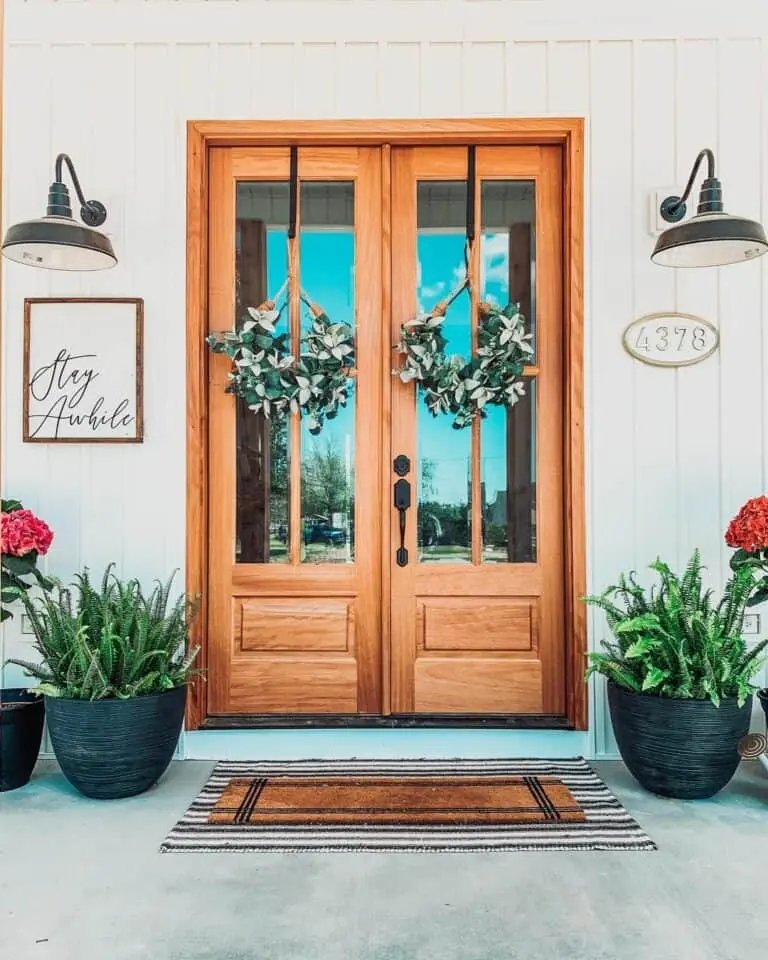 Wooden Doors with Green Wreaths